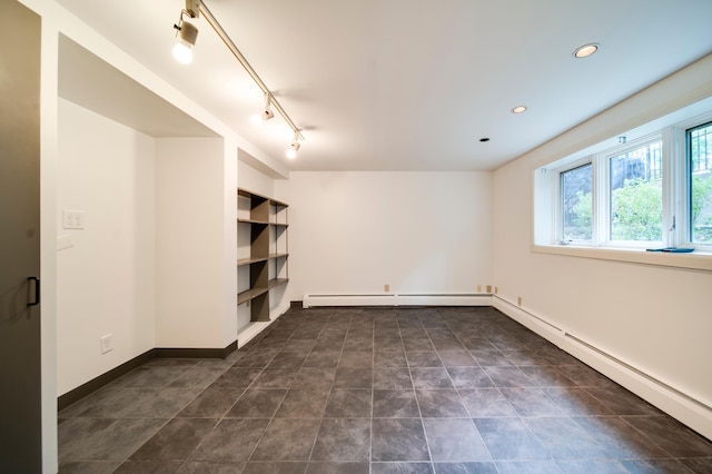 unfurnished room featuring track lighting and recessed lighting