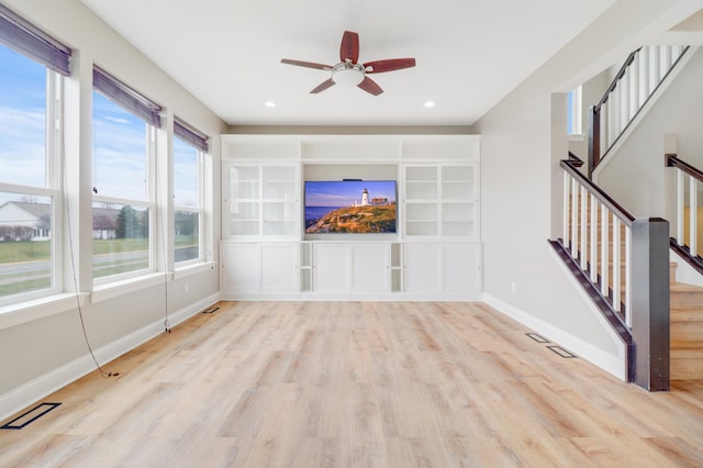 20024 Fern Glen Ln N, Forest Lake, MN 55025 - unfurnished living room featuring wood finished floors, a ceiling fan, baseboards, stairs, and recessed lighting