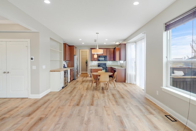 20024 Fern Glen Ln N, Forest Lake, MN 55025 - kitchen featuring black appliances, beverage cooler, recessed lighting, brown cabinets, and light wood-style flooring