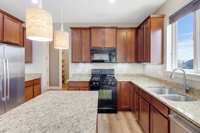 20024 Fern Glen Ln N, Forest Lake, MN 55025 - kitchen featuring black appliances, a sink, plenty of natural light, light wood-style floors, and recessed lighting