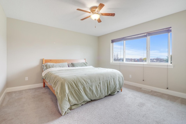 20024 Fern Glen Ln N, Forest Lake, MN 55025 - carpeted bedroom with baseboards and ceiling fan