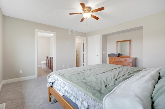 20024 Fern Glen Ln N, Forest Lake, MN 55025 - bedroom featuring baseboards, light colored carpet, connected bathroom, and a ceiling fan