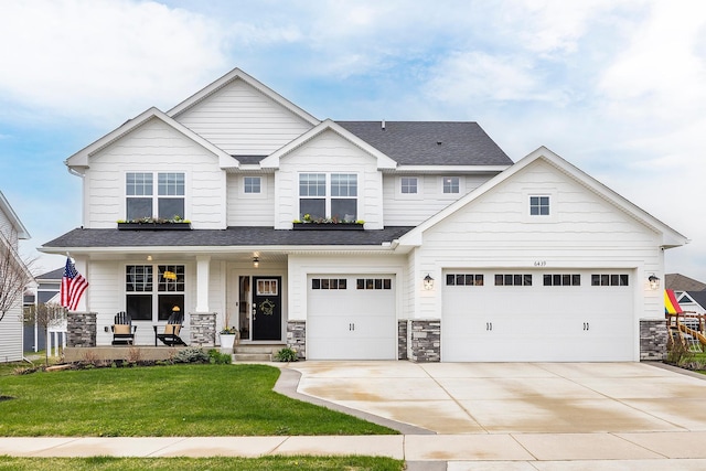 craftsman-style house featuring concrete driveway, a porch, a front lawn, and stone siding