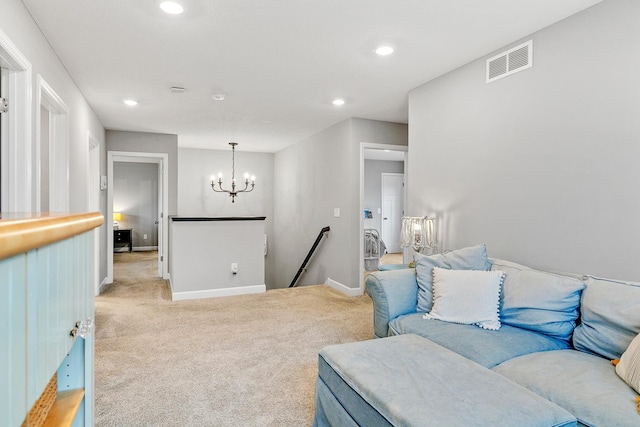 carpeted living room with baseboards, recessed lighting, a chandelier, and visible vents