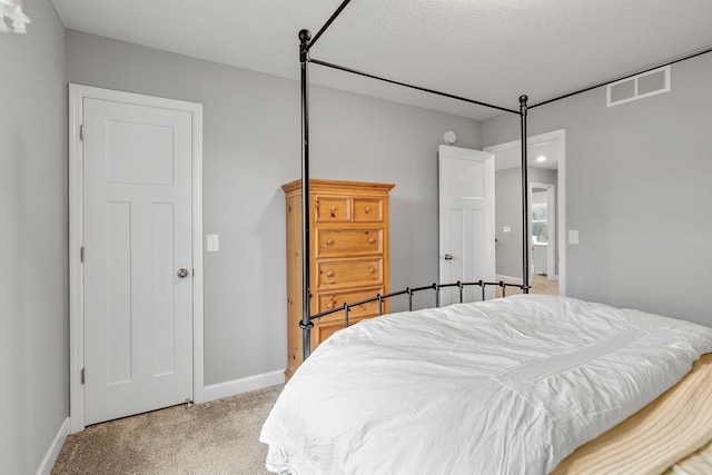 bedroom featuring carpet flooring, baseboards, and visible vents