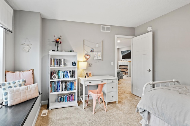 bedroom with light colored carpet and visible vents