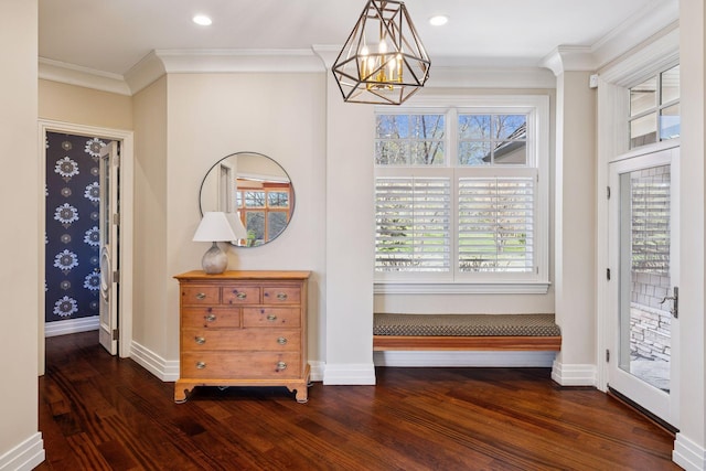 interior space with dark wood-style flooring, crown molding, baseboards, a chandelier, and recessed lighting