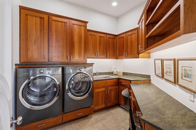 washroom featuring a sink, recessed lighting, cabinet space, and washer and dryer
