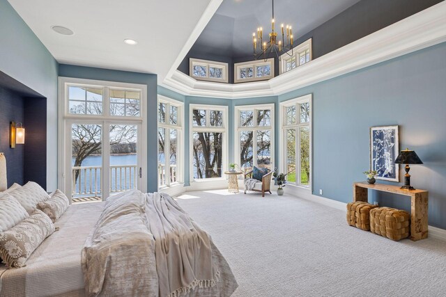 bedroom featuring carpet flooring, access to outside, an inviting chandelier, multiple windows, and baseboards