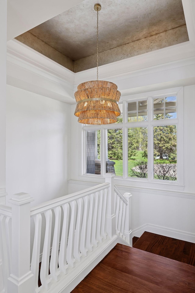 unfurnished dining area with an inviting chandelier and wood finished floors