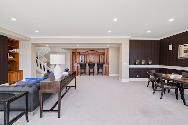 living room with recessed lighting, crown molding, light carpet, and stairway