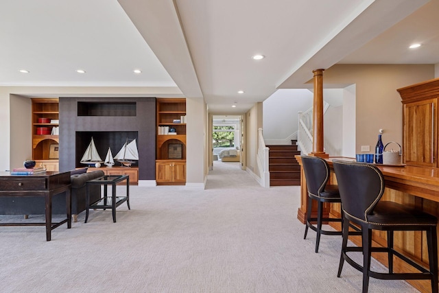 bar with light carpet, stairs, recessed lighting, baseboards, and a bar