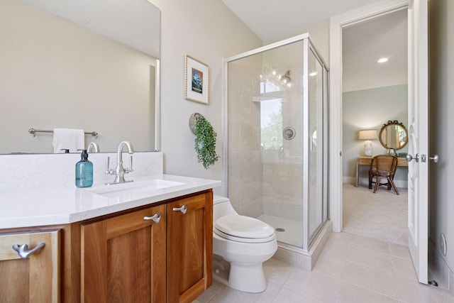 full bath with vanity, toilet, tile patterned floors, and a stall shower