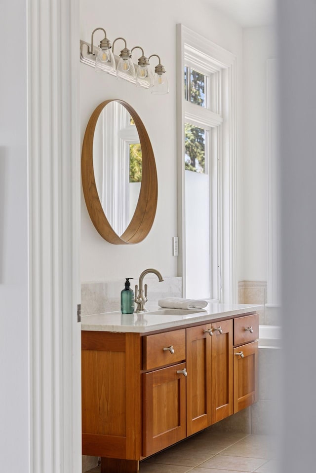 bathroom with tile patterned floors and vanity