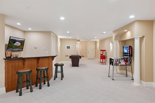 playroom with decorative columns, wet bar, baseboards, light carpet, and recessed lighting