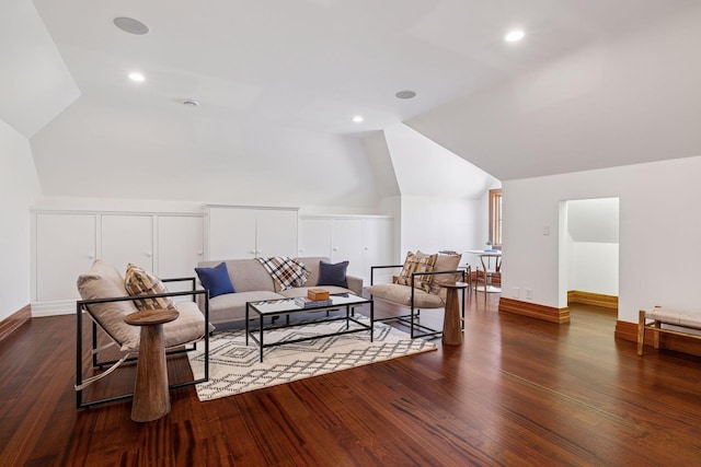 living area with baseboards, recessed lighting, lofted ceiling, and wood finished floors