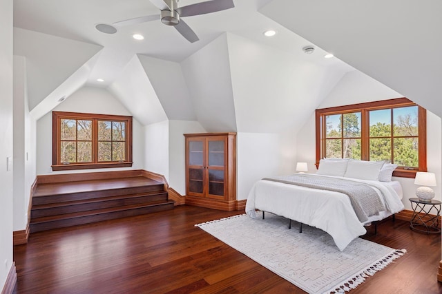 bedroom featuring baseboards, recessed lighting, lofted ceiling, and wood finished floors