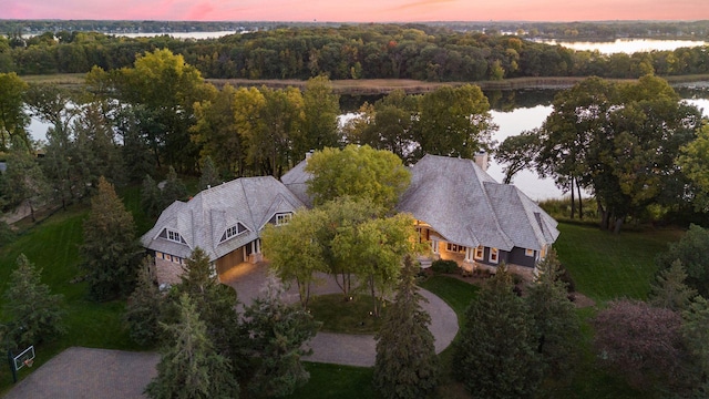 aerial view at dusk with a water view