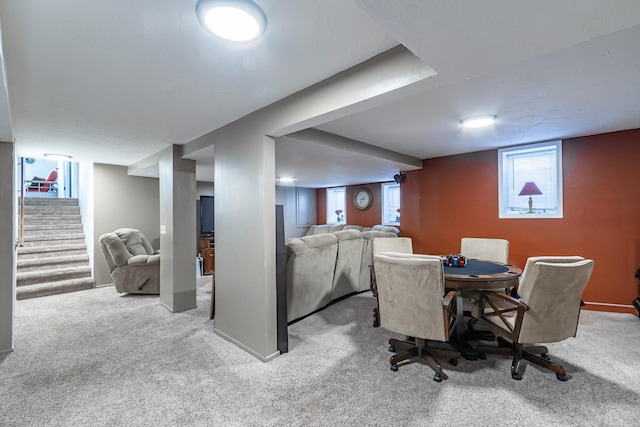 dining area with carpet floors and stairs