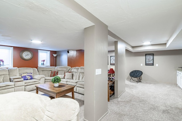 living room with light colored carpet and baseboards
