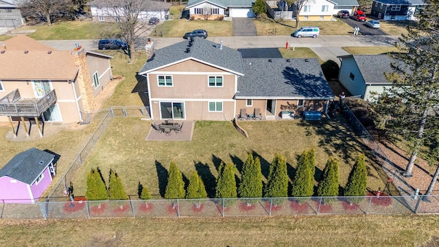 birds eye view of property with a residential view
