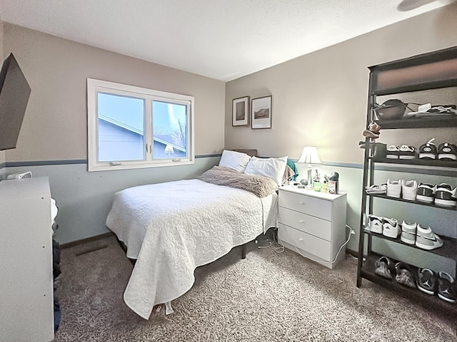 bedroom featuring carpet flooring and baseboards