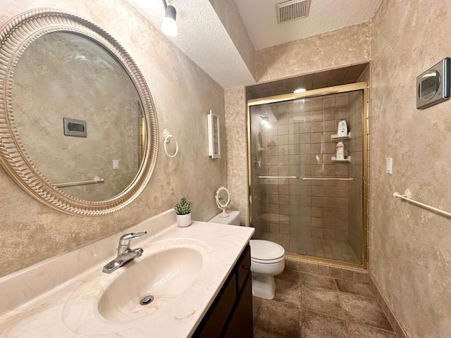 full bath with a shower stall, vanity, visible vents, and toilet