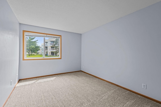 120 Demont Ave E Unit 103, Little Canada, MN 55117 - carpeted spare room with a textured ceiling