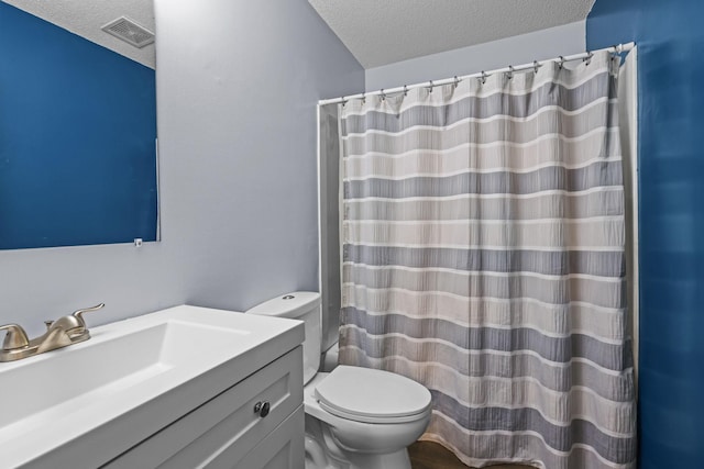 120 Demont Ave E Unit 103, Little Canada, MN 55117 - bathroom featuring a textured ceiling, vanity, and a shower with curtain