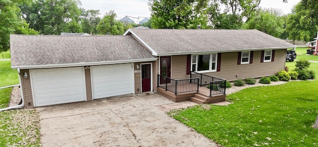 603 Maple Ave, Olivia, MN 56277 - ranch-style house with a garage, a shingled roof, driveway, and a front yard