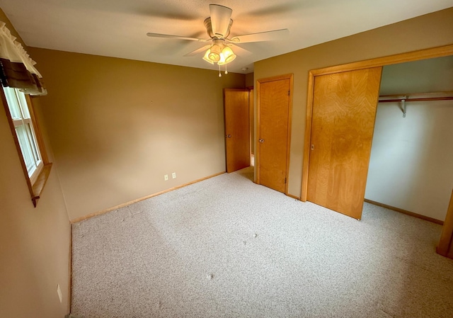 603 Maple Ave, Olivia, MN 56277 - unfurnished bedroom featuring carpet flooring, multiple closets, and a ceiling fan