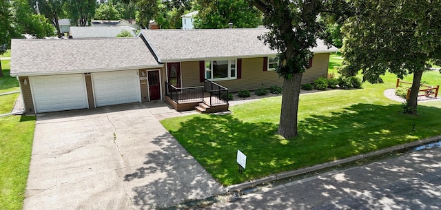 603 Maple Ave, Olivia, MN 56277 - ranch-style home with a garage, driveway, a front lawn, and roof with shingles