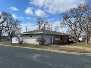 view of side of home with a garage