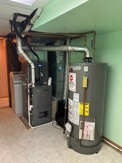 utility room with gas water heater