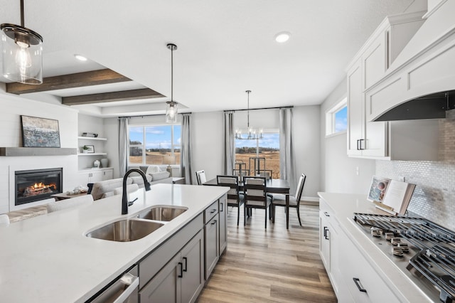 548 Mallard St NE, Hanover, MN 55341 - kitchen with stainless steel gas cooktop, recessed lighting, light wood finished floors, decorative backsplash, and light countertops
