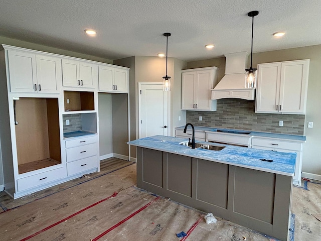 548 Mallard St NE, Hanover, MN 55341 - kitchen featuring custom range hood, tasteful backsplash, white cabinetry, a textured ceiling, and recessed lighting