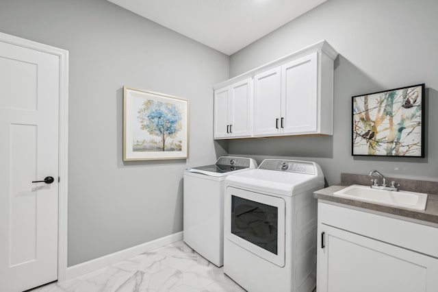 548 Mallard St NE, Hanover, MN 55341 - laundry area featuring separate washer and dryer, cabinet space, and light marble finish floors