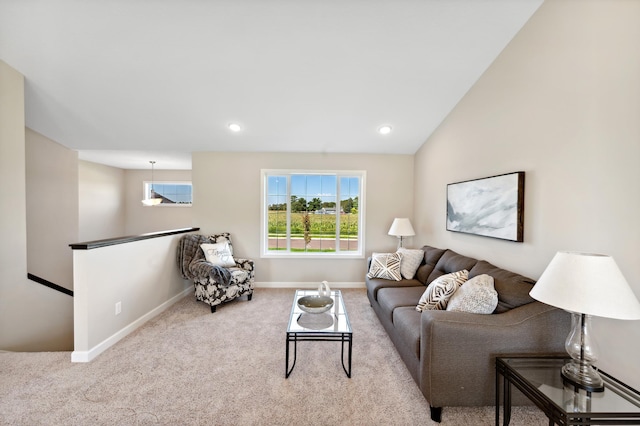 carpeted living room with recessed lighting and baseboards