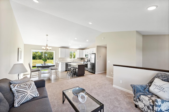 living room featuring vaulted ceiling, baseboards, recessed lighting, and a chandelier