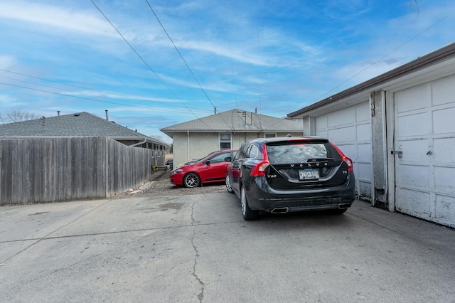 view of car parking with fence