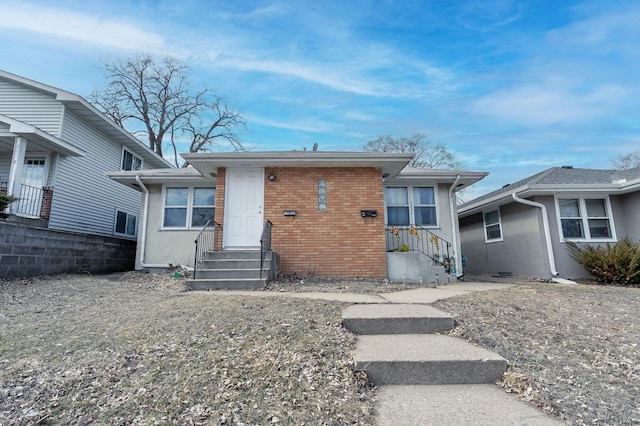 view of front of house featuring brick siding