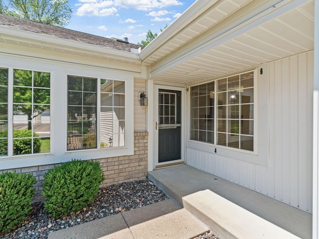 9323 Kimberly Ln N, Maple Grove, MN 55311 - property entrance with brick siding and a shingled roof