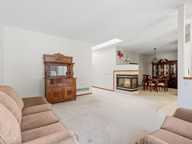 9323 Kimberly Ln N, Maple Grove, MN 55311 - carpeted living area with a multi sided fireplace and a skylight