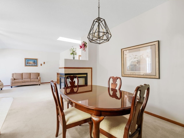9323 Kimberly Ln N, Maple Grove, MN 55311 - dining room featuring light colored carpet, lofted ceiling, and a multi sided fireplace