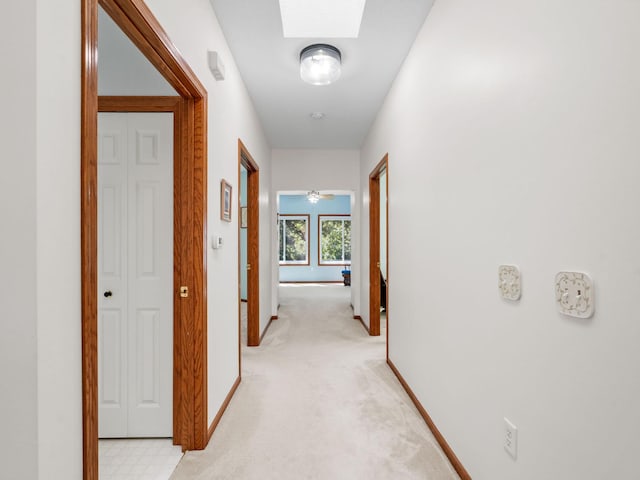 9323 Kimberly Ln N, Maple Grove, MN 55311 - hallway with light carpet and a skylight