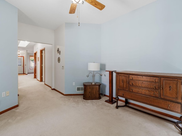 9323 Kimberly Ln N, Maple Grove, MN 55311 - sitting room featuring a ceiling fan, light carpet, and a skylight