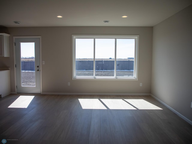 861 2nd Ave, Horace, ND 58047 - unfurnished living room with dark wood finished floors, baseboards, and recessed lighting