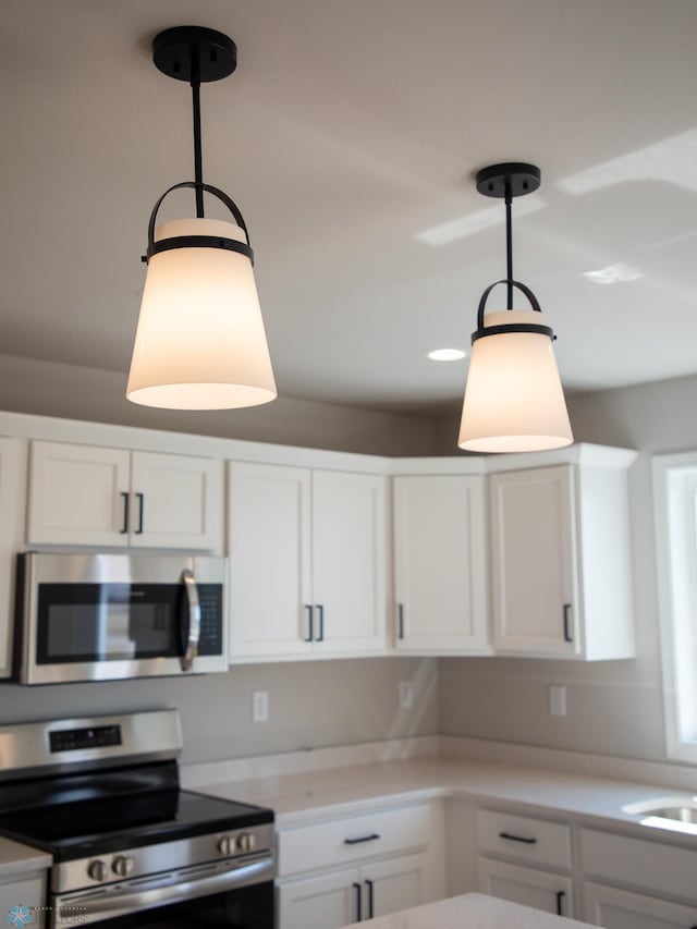 861 2nd Ave, Horace, ND 58047 - kitchen featuring appliances with stainless steel finishes, white cabinets, and light countertops