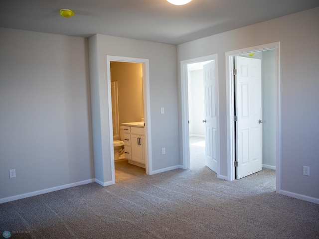 861 2nd Ave, Horace, ND 58047 - unfurnished bedroom featuring carpet, ensuite bath, and baseboards