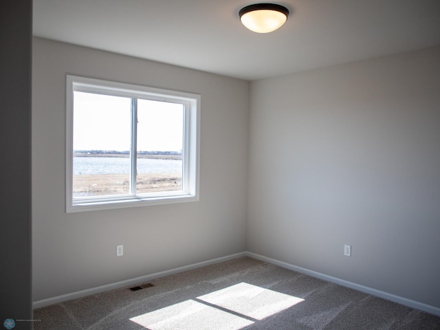 861 2nd Ave, Horace, ND 58047 - carpeted spare room featuring baseboards